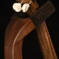 Folding walnut wood ukulele floor stand yoke detail image with Martin ukulele