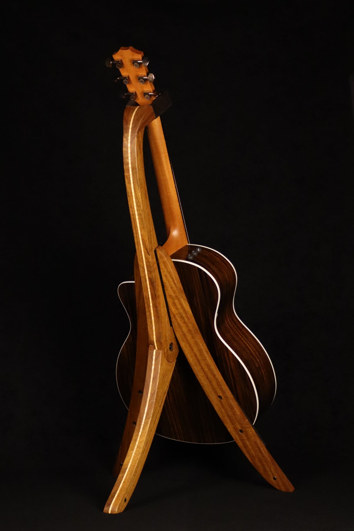 Folding sheuda ovangkol and curly maple wood guitar stand full rear image with Taylor guitar