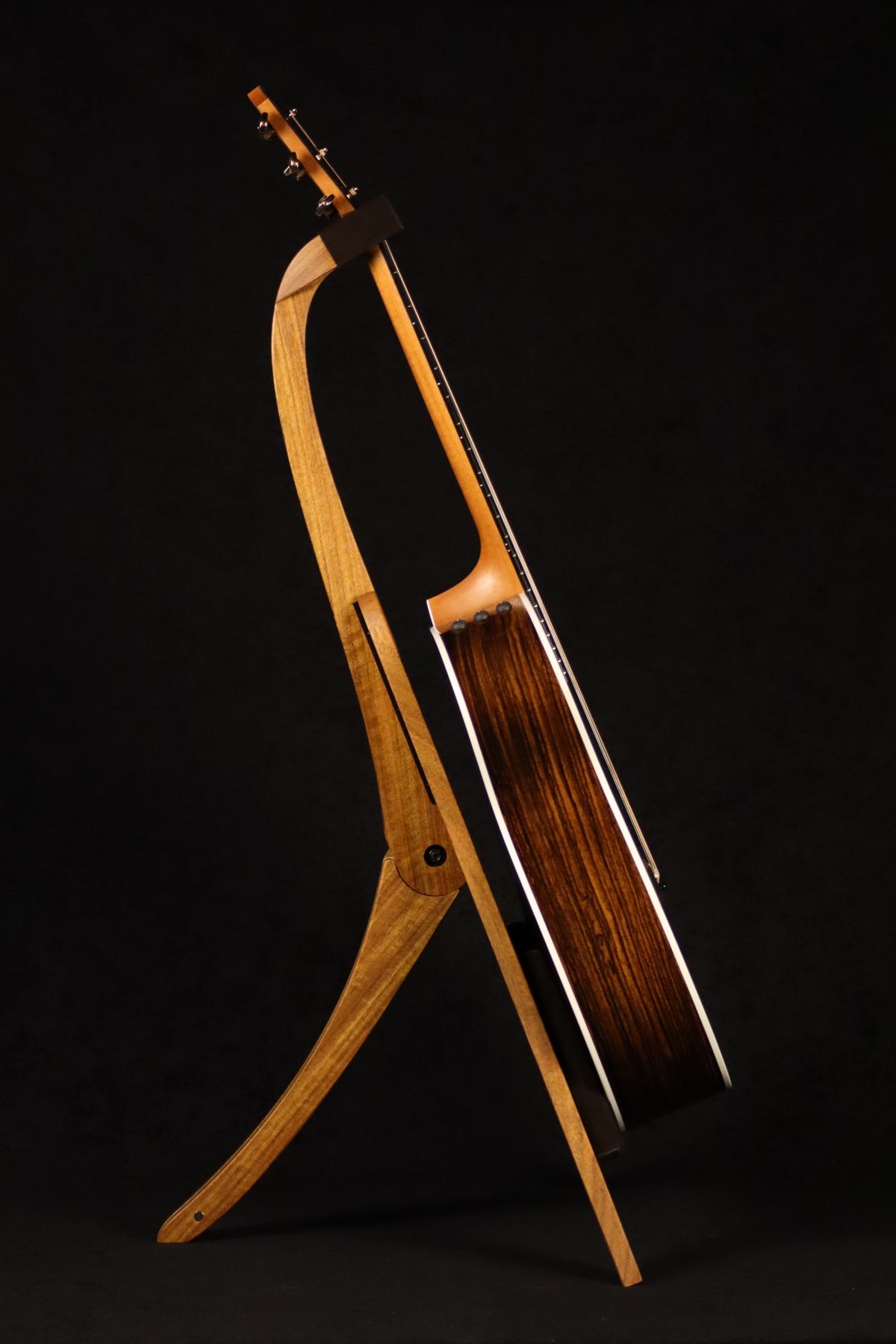 Folding sheuda ovangkol and curly maple wood guitar stand full side image with Taylor guitar