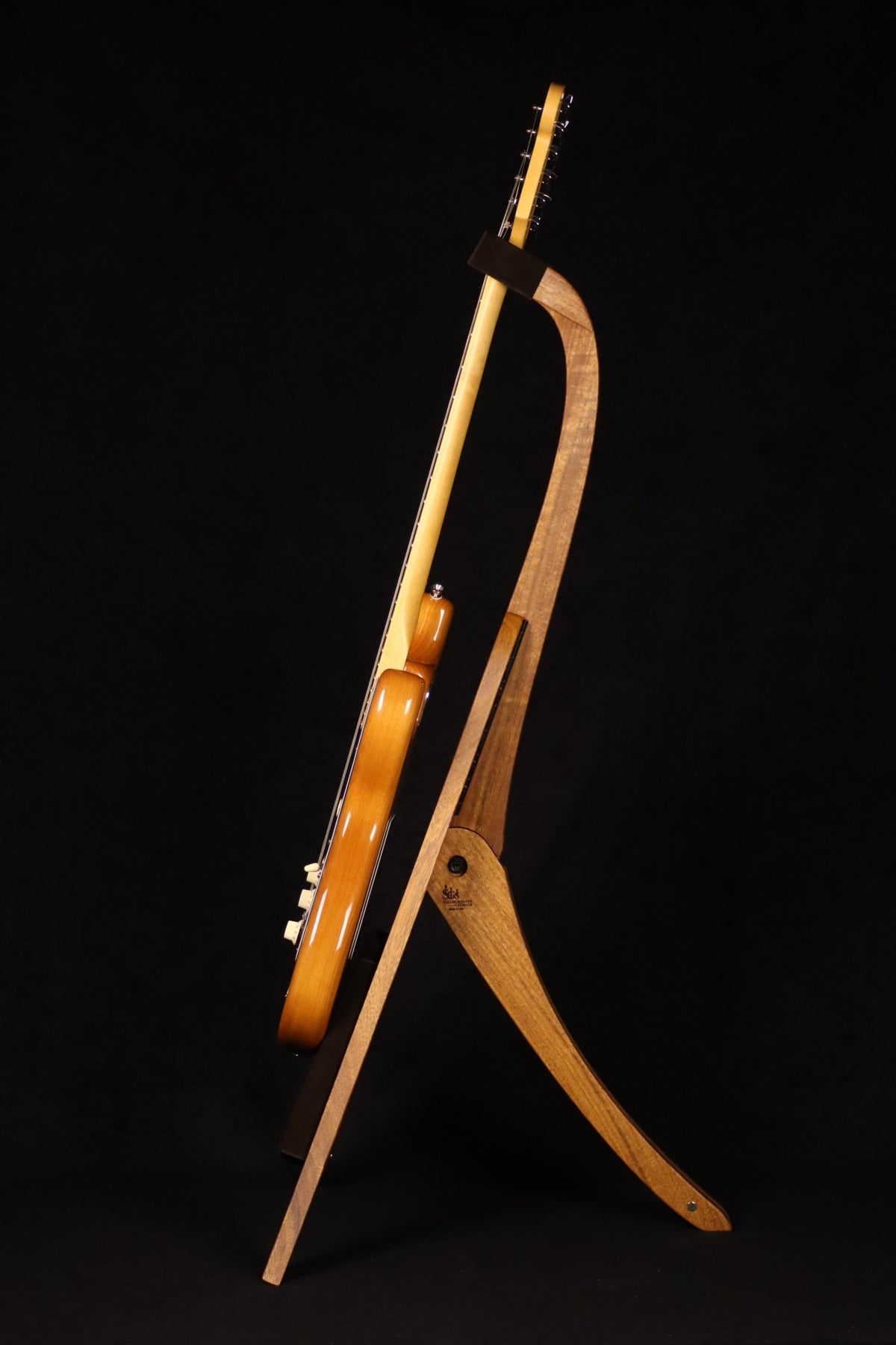 Folding sheuda ovangkol and curly maple wood guitar stand full side image with Fender guitar