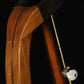 Folding cherry and walnut wood banjo floor stand yoke detail image with Alvarez banjo