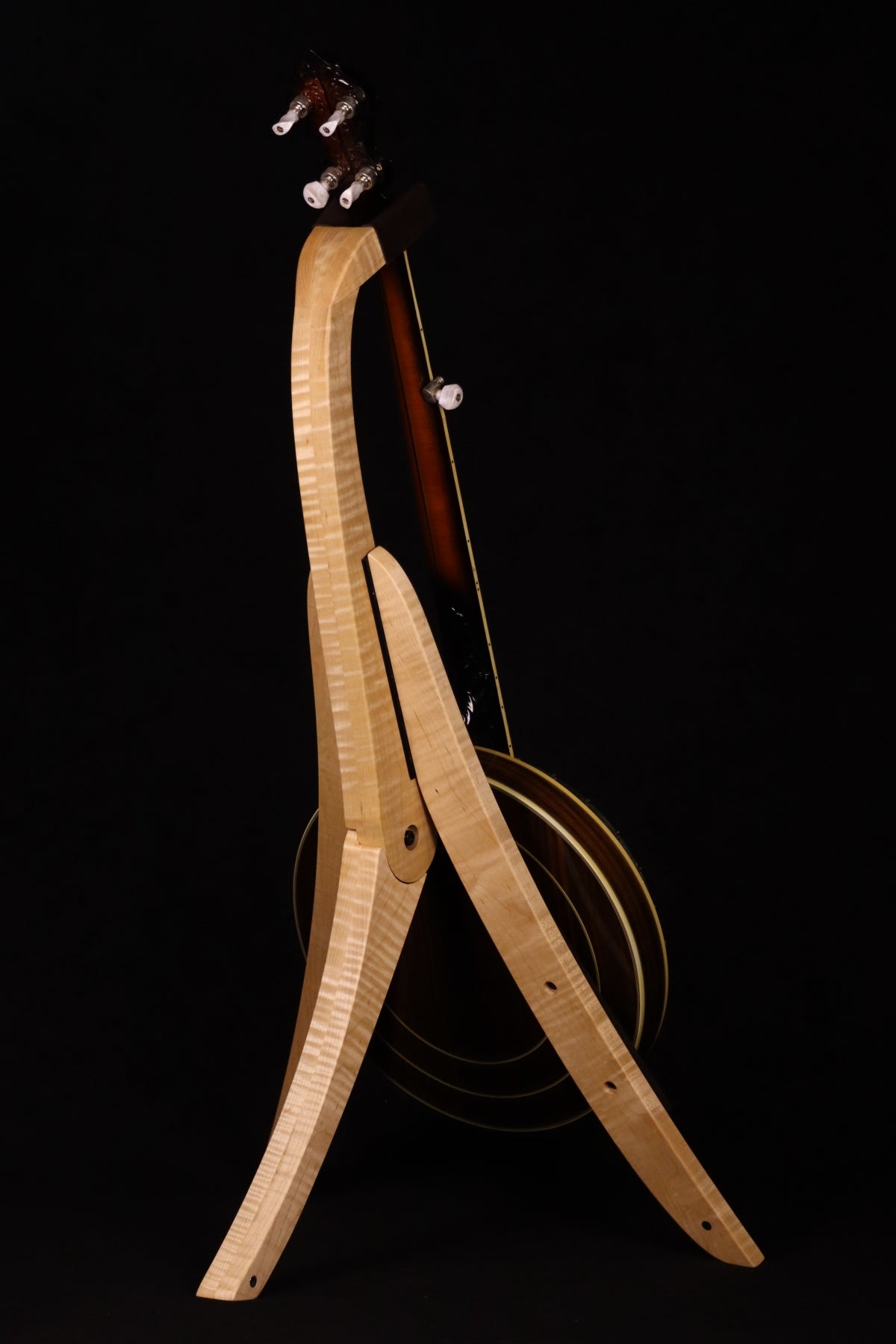 Folding curly maple wood banjo floor stand full rear image with Alvarez banjo