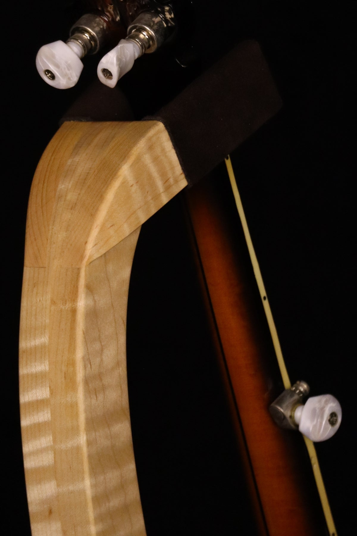 Folding curly maple wood banjo floor stand yoke detail image with Alvarez banjo