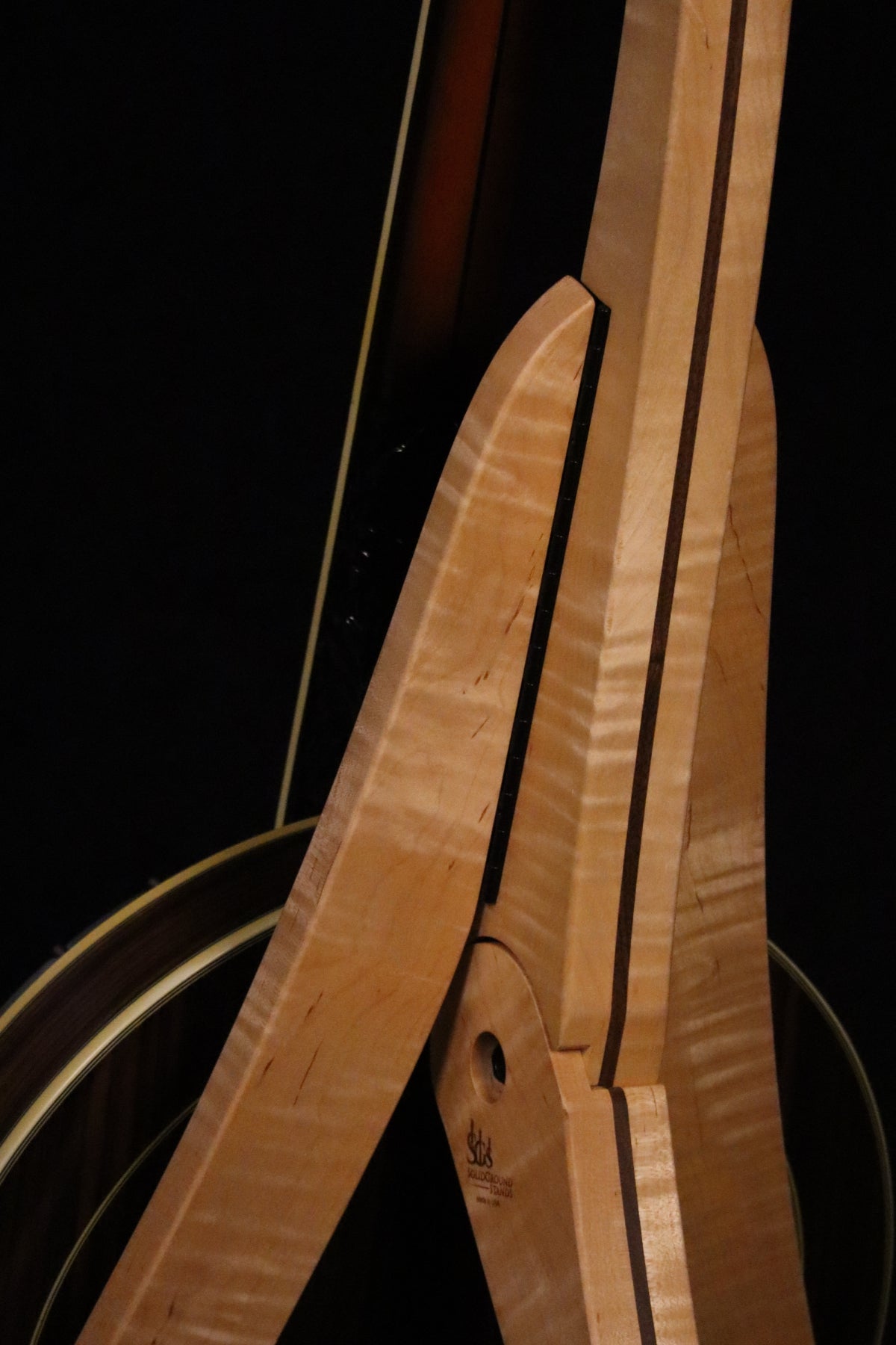 Folding curly maple and walnut wood banjo floor stand closeup rear image with Alvarez banjo