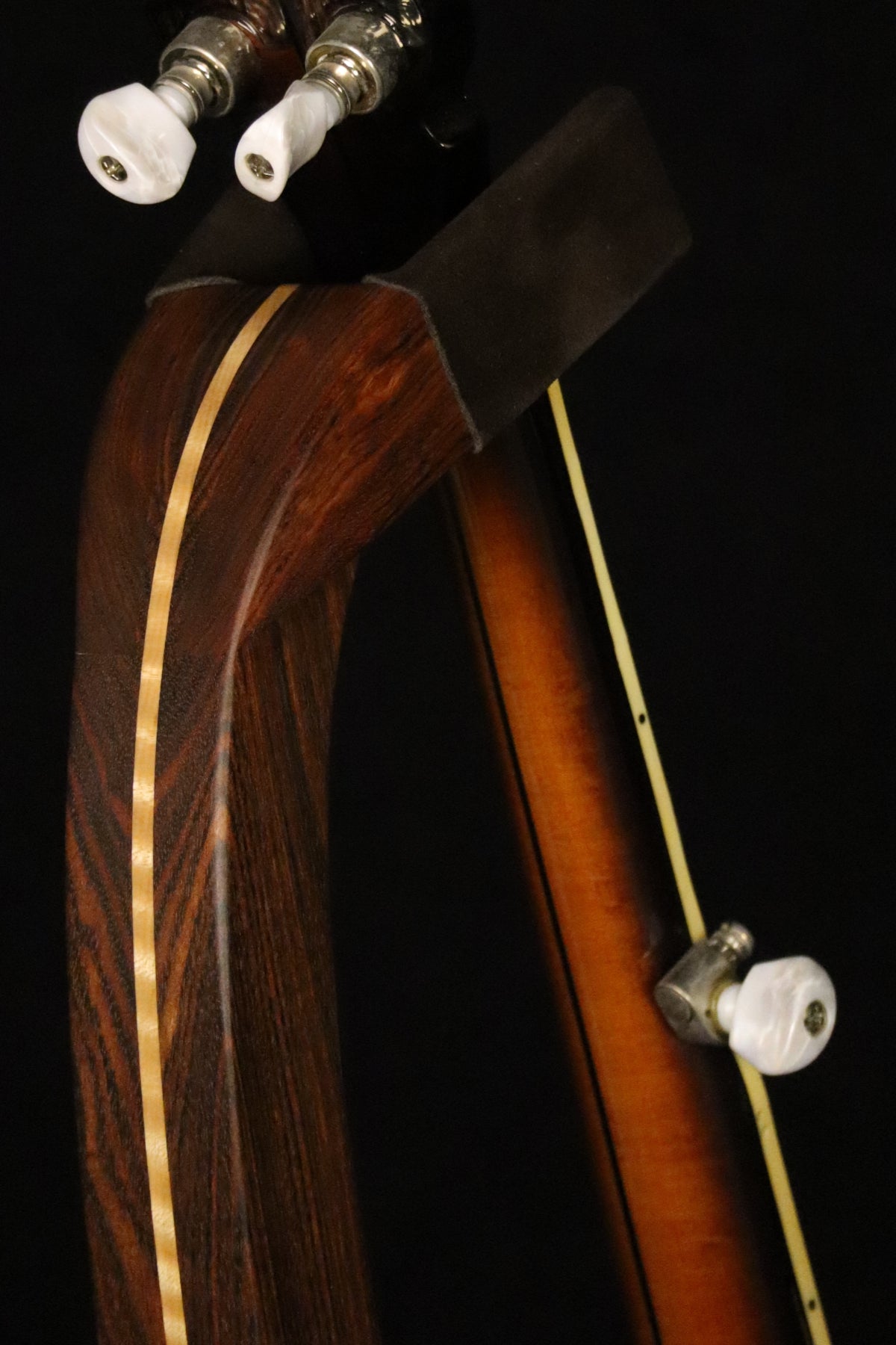 Folding chechen Caribbean rosewood and curly maple wood banjo floor stand yoke detail image with Alvarez banjo