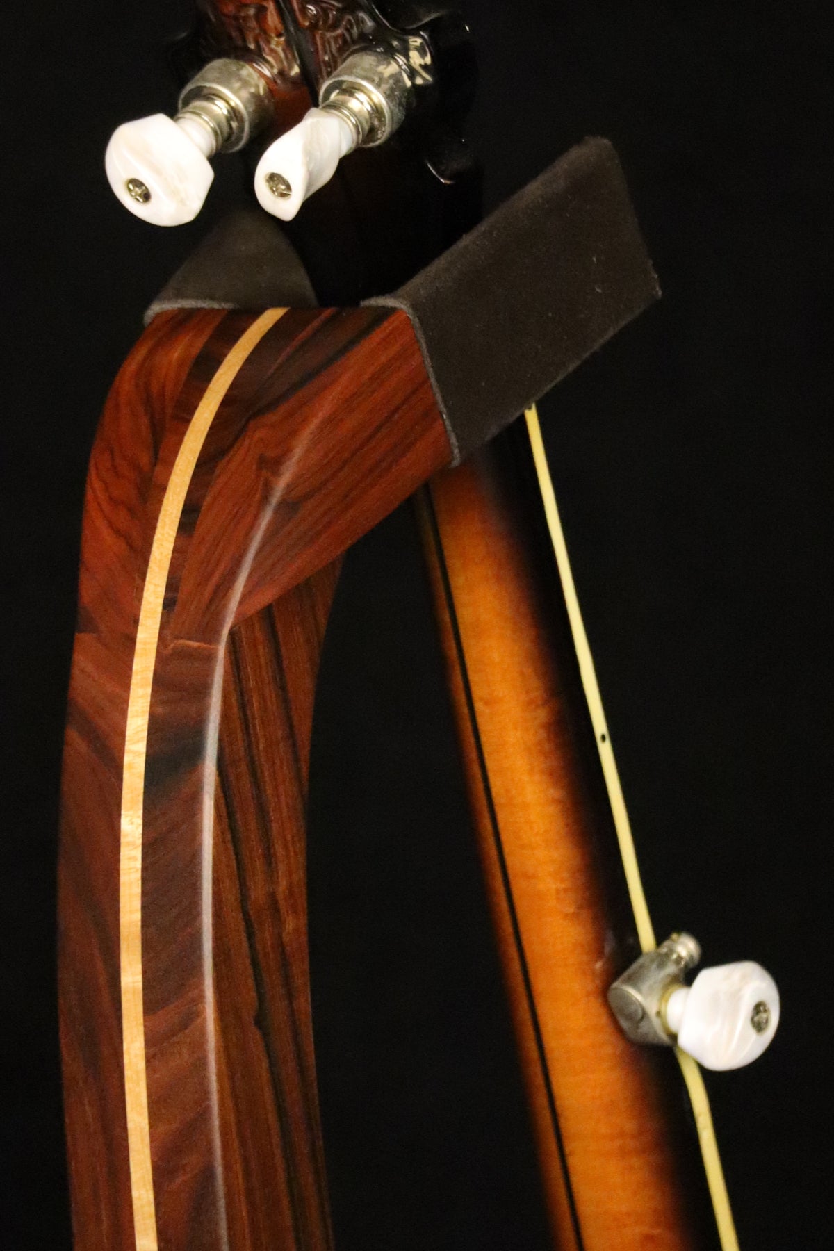 Folding morado Bolivian rosewood pau fero and curly maple wood banjo floor stand yoke detail image with Alvarez banjo