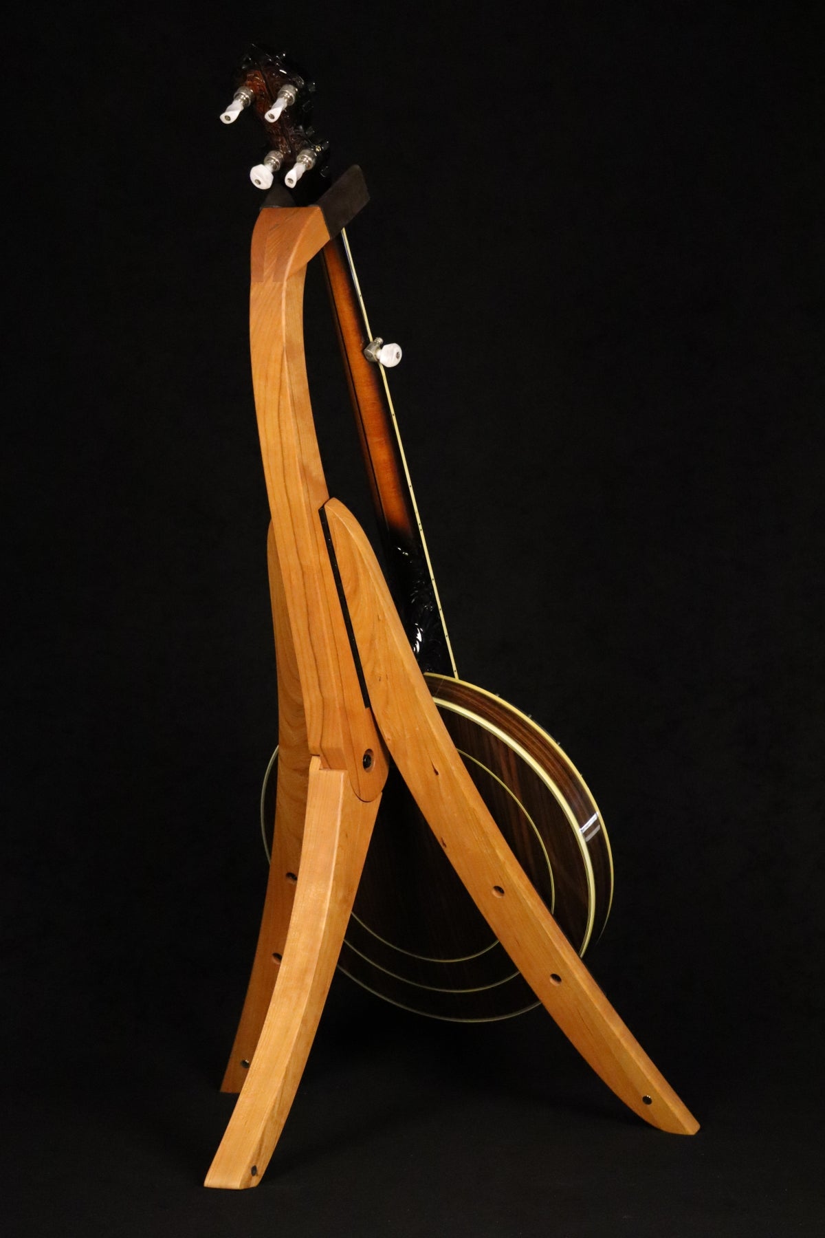 Folding cherry wood banjo floor stand full rear image with Alvarez banjo