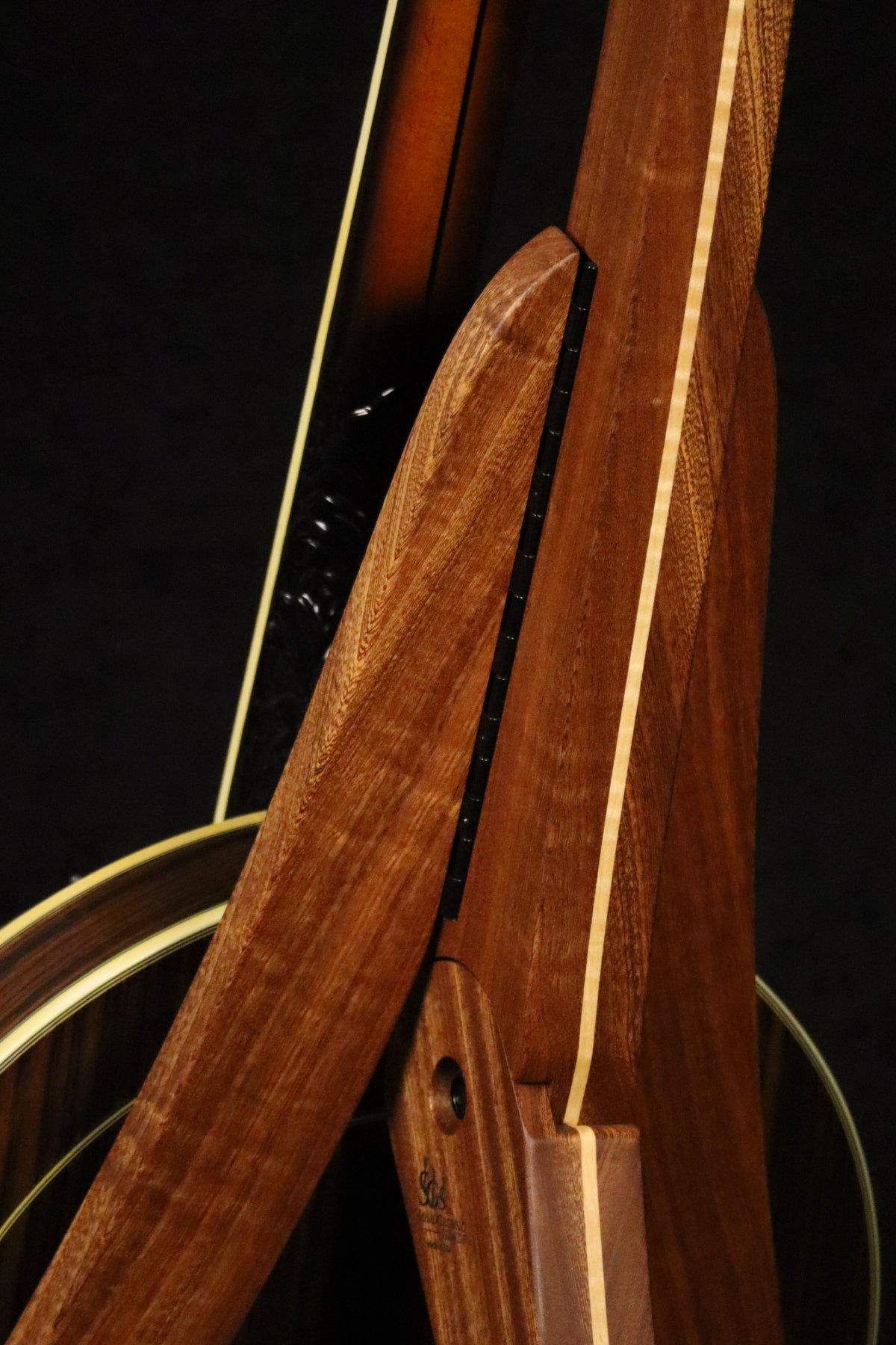 Folding sapele mahogany and curly maple wood banjo floor stand closeup rear image with Alvarez banjo