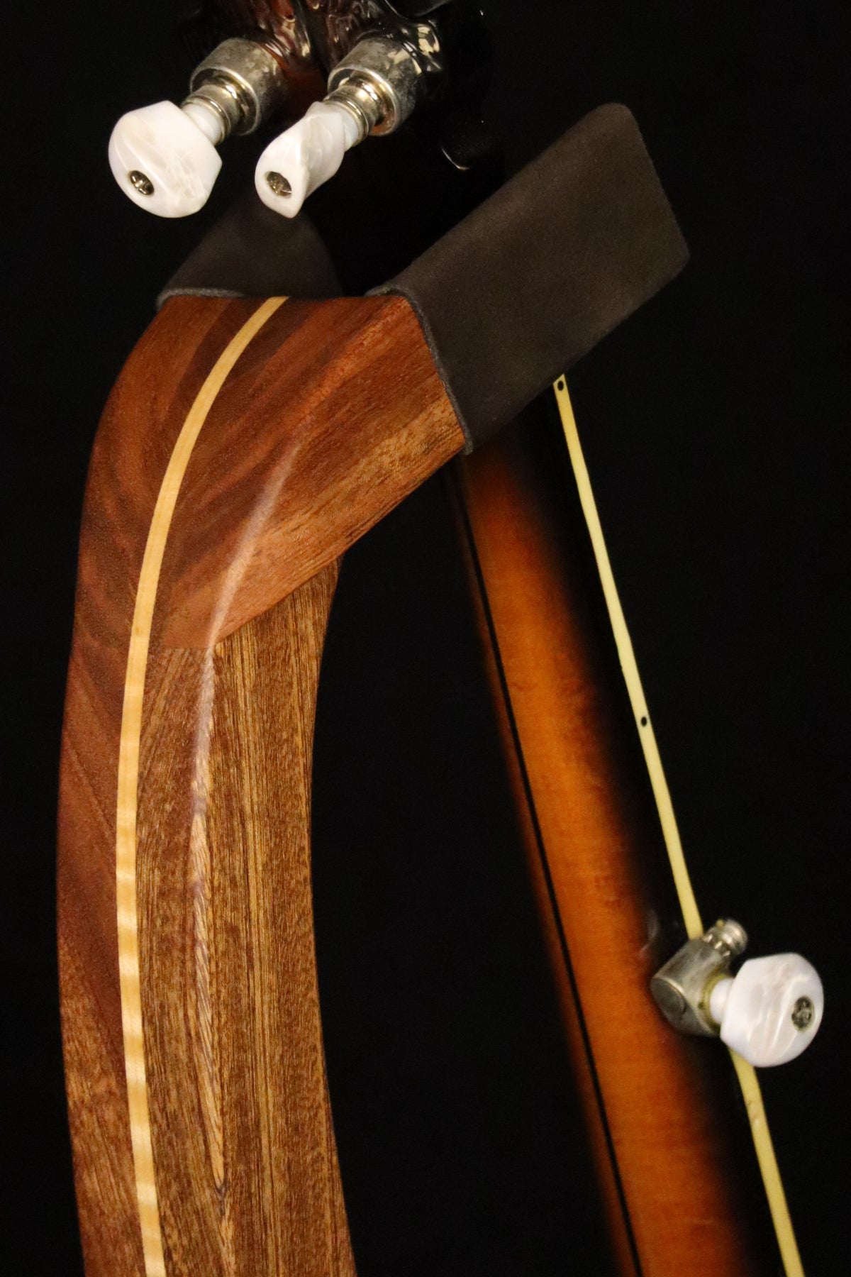 Folding sapele mahogany and curly maple wood banjo floor stand yoke detail image with Alvarez banjo