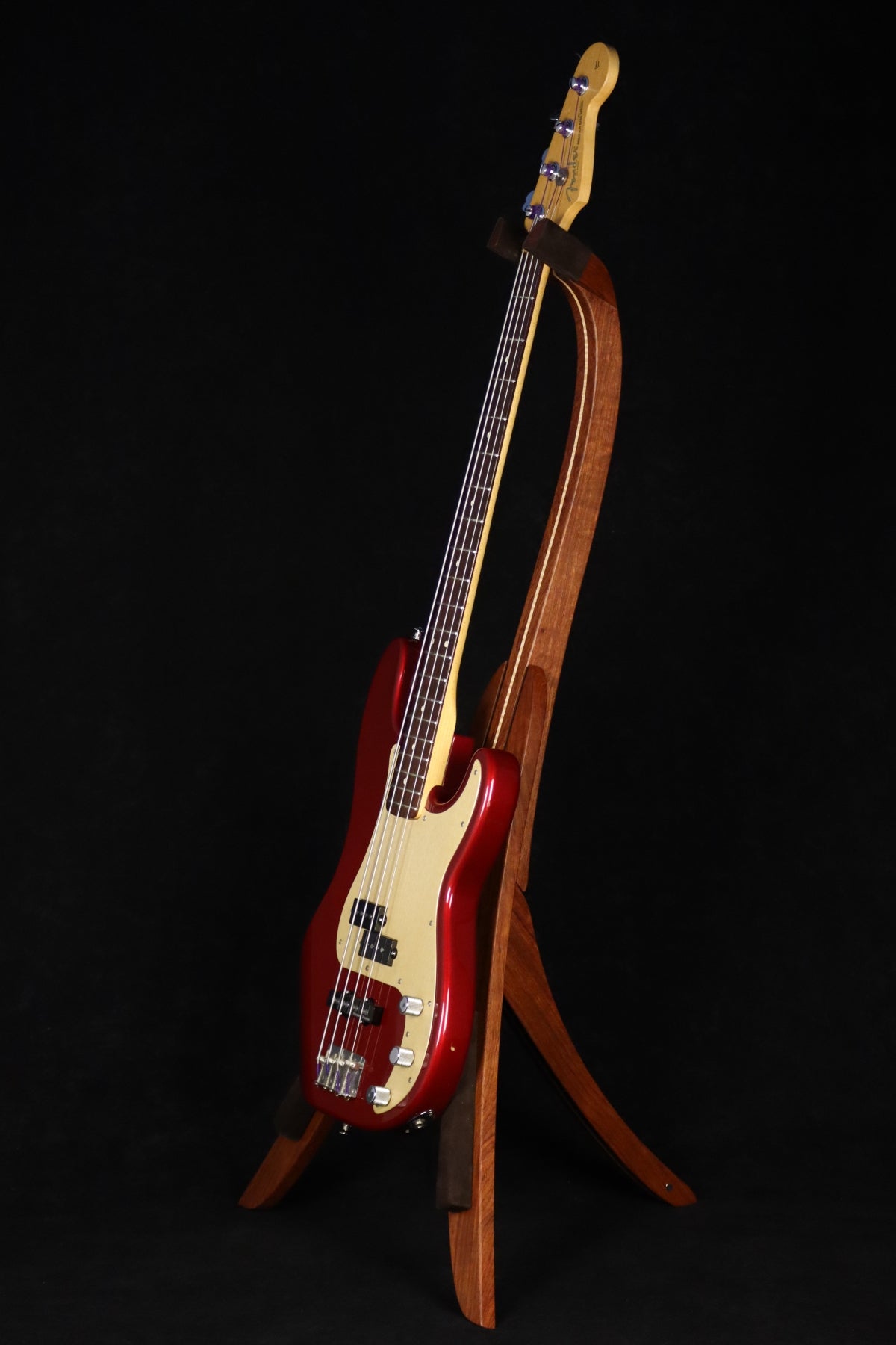 Folding bubinga rosewood and curly maple wood electric bass guitar floor stand full front image with Fender Jazz 4 string bass