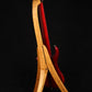 Folding cherry wood electric bass guitar floor stand full rear image with Pedulla 6 string fretless bass