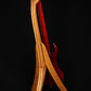 Folding cherry and walnut wood electric bass guitar floor stand full rear image with Pedulla 6 string fretless bass