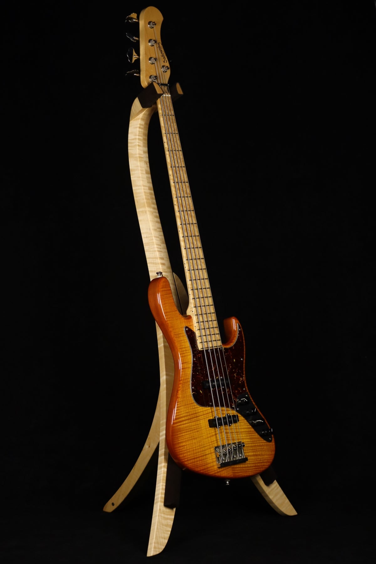 Folding curly maple wood electric bass guitar floor stand full front image with Sadowsky 5 string bass