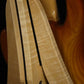 Folding curly maple and walnut wood electric bass guitar floor stand closeup rear image