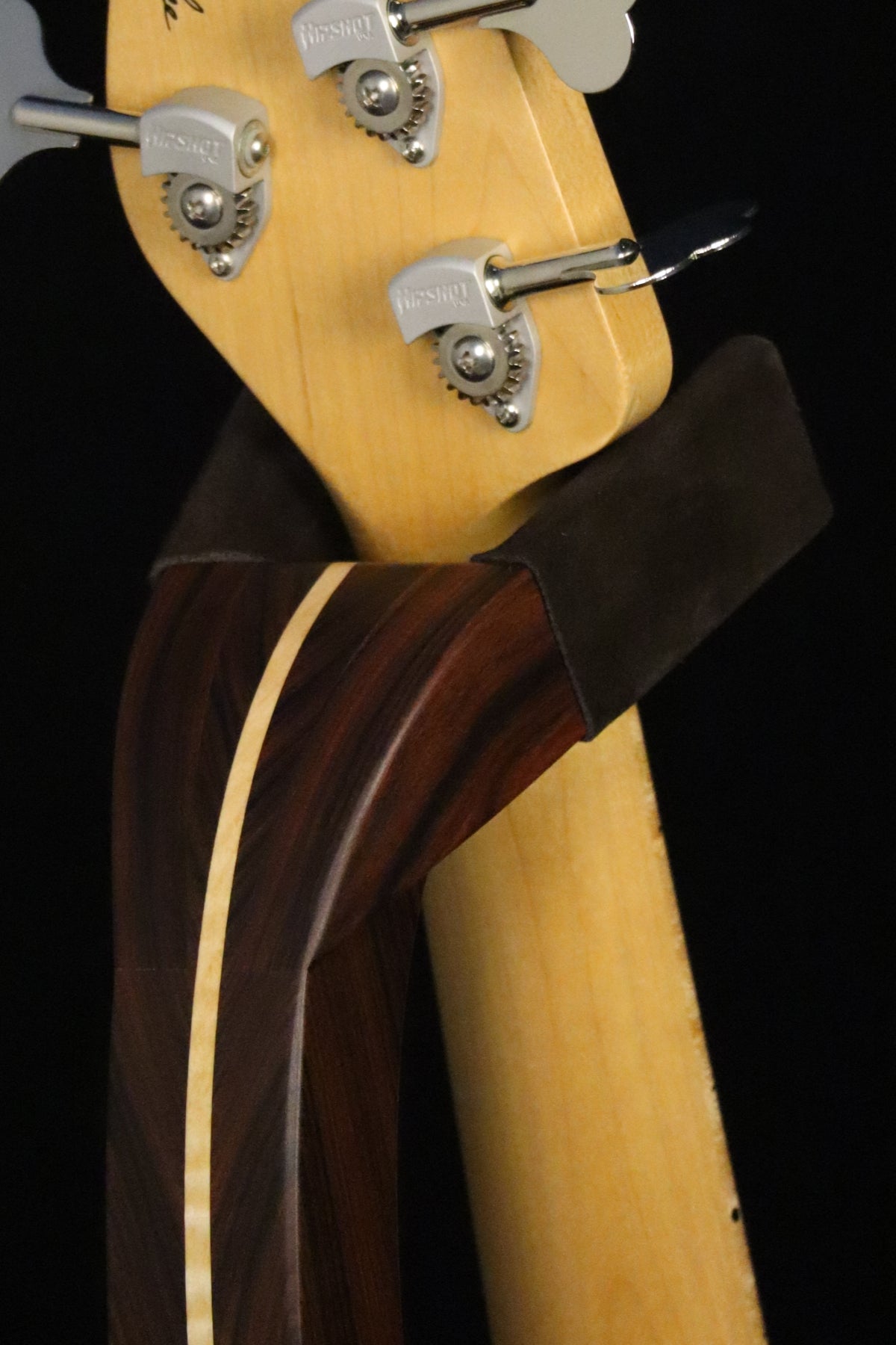 Folding morado Bolivian rosewood and curly maple wood electric bass guitar floor stand closeup yoke detail image
