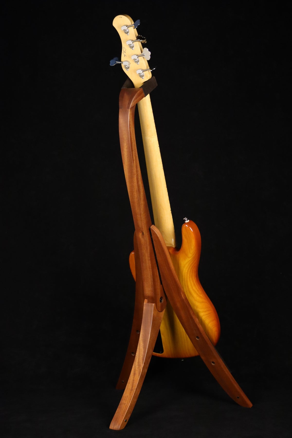 Folding sapele mahogany wood electric bass guitar floor stand full rear image with Sadowsky 5 string bass