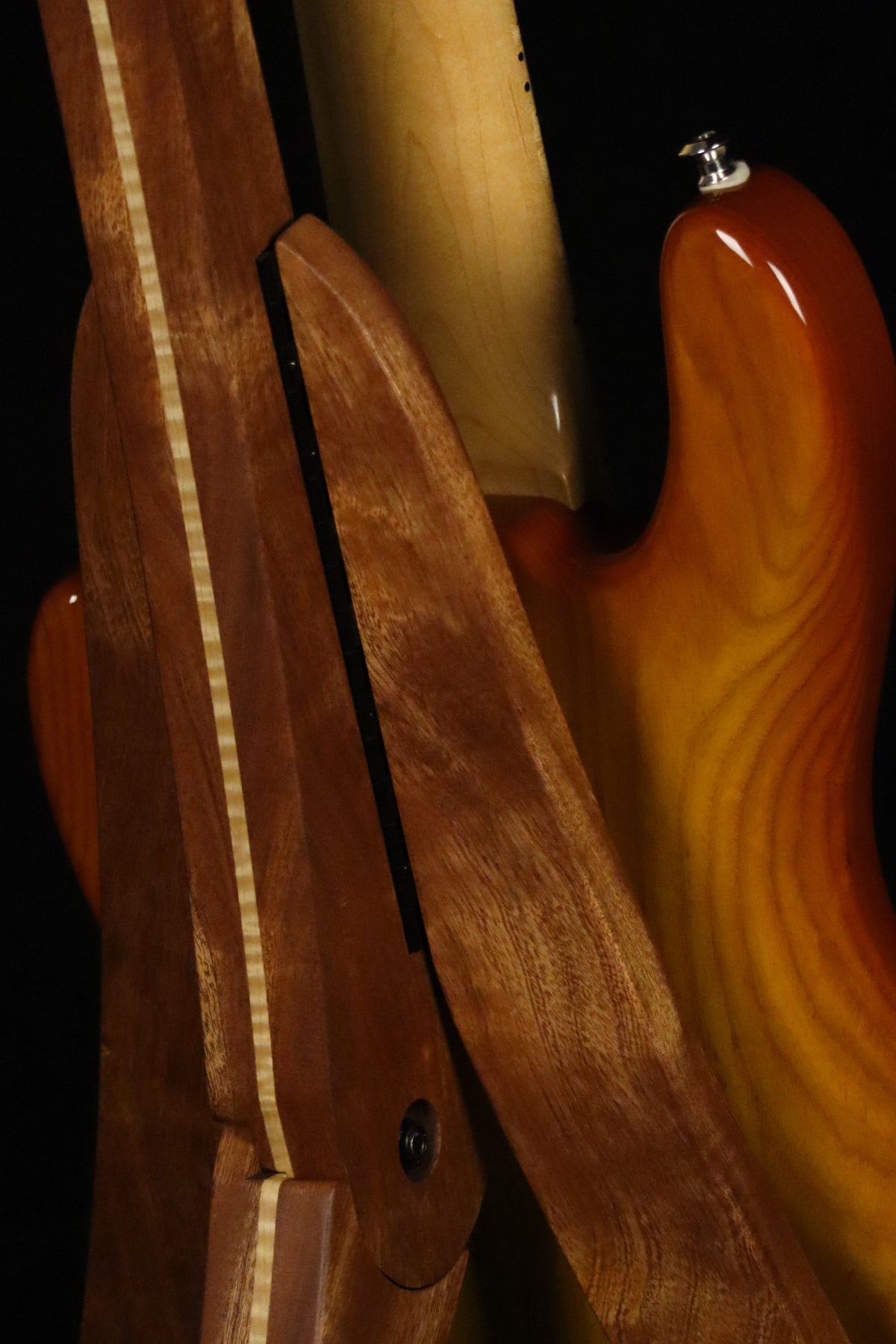 Folding sapele mahogany and curly maple wood electric bass guitar floor stand closeup rear image