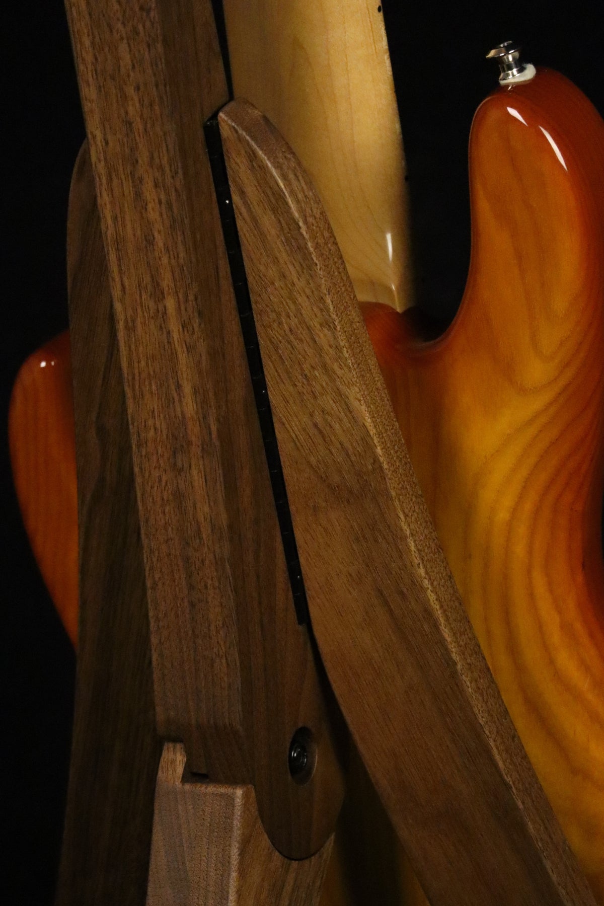 Folding walnut wood electric bass guitar floor stand closeup rear image