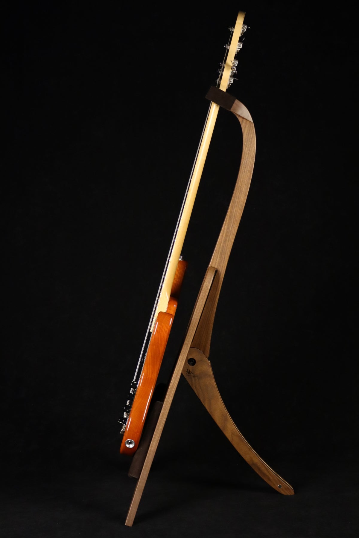 Folding walnut and curly maple wood electric bass guitar floor stand full side image with Sadowsky 5 string bass