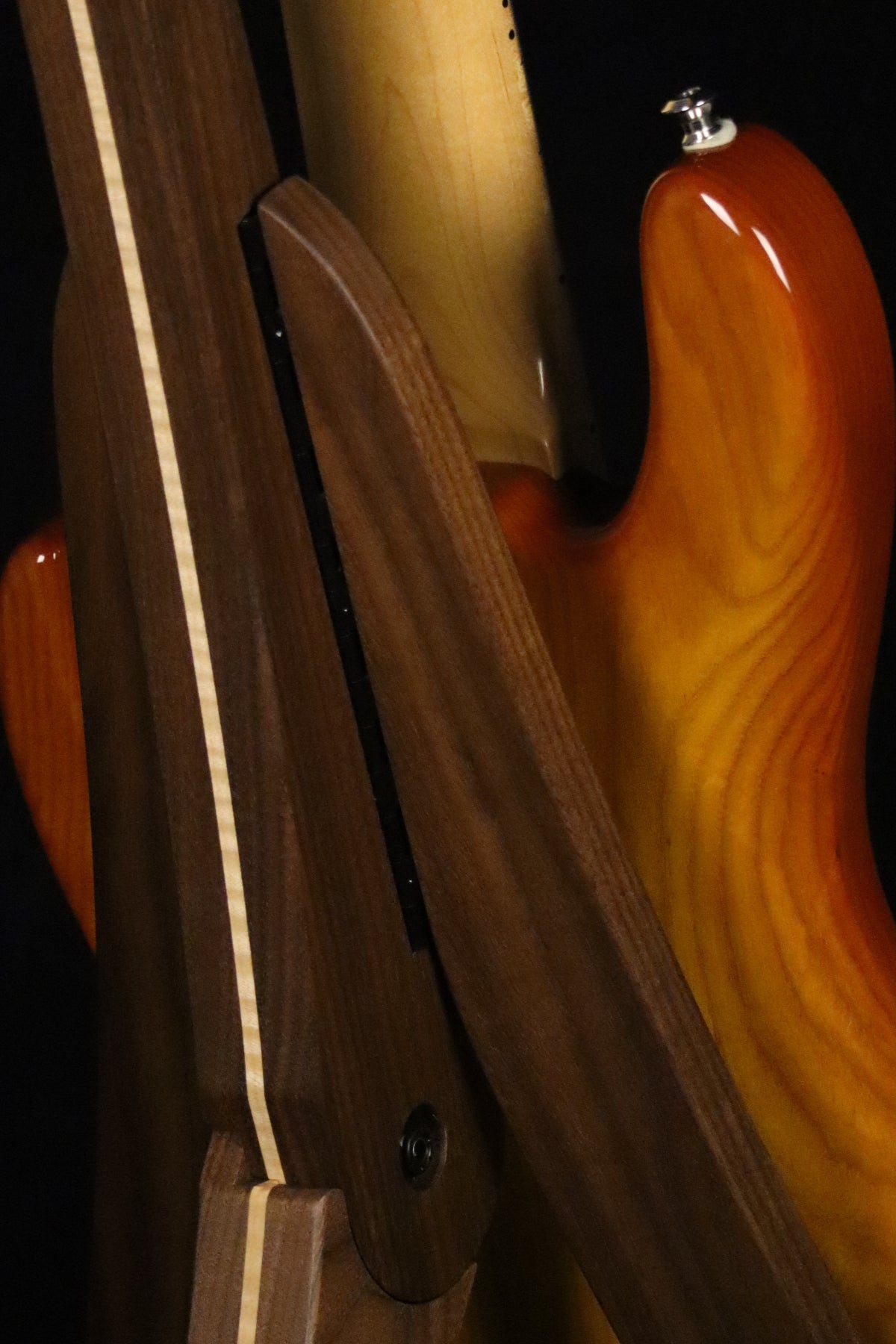 Folding walnut and curly maple wood electric bass guitar floor stand closeup rear image