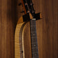 Curly maple and walnut wood guitar wall mount hanger installed on paneled wall with Taylor guitar