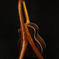 Folding bubinga rosewood and curly maple wood guitar floor stand full rear image with Taylor guitar