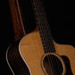 Folding bubinga rosewood and curly maple wood guitar floor stand closeup front image with Taylor guitar
