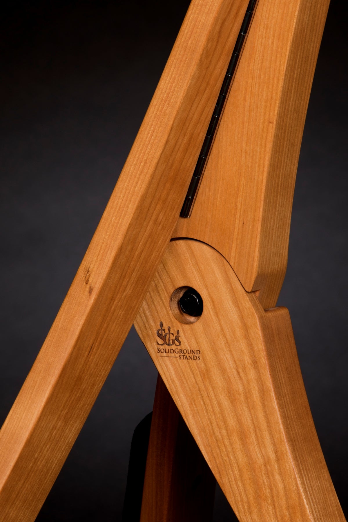 Folding cherry wood guitar floor stand joinery detail image
