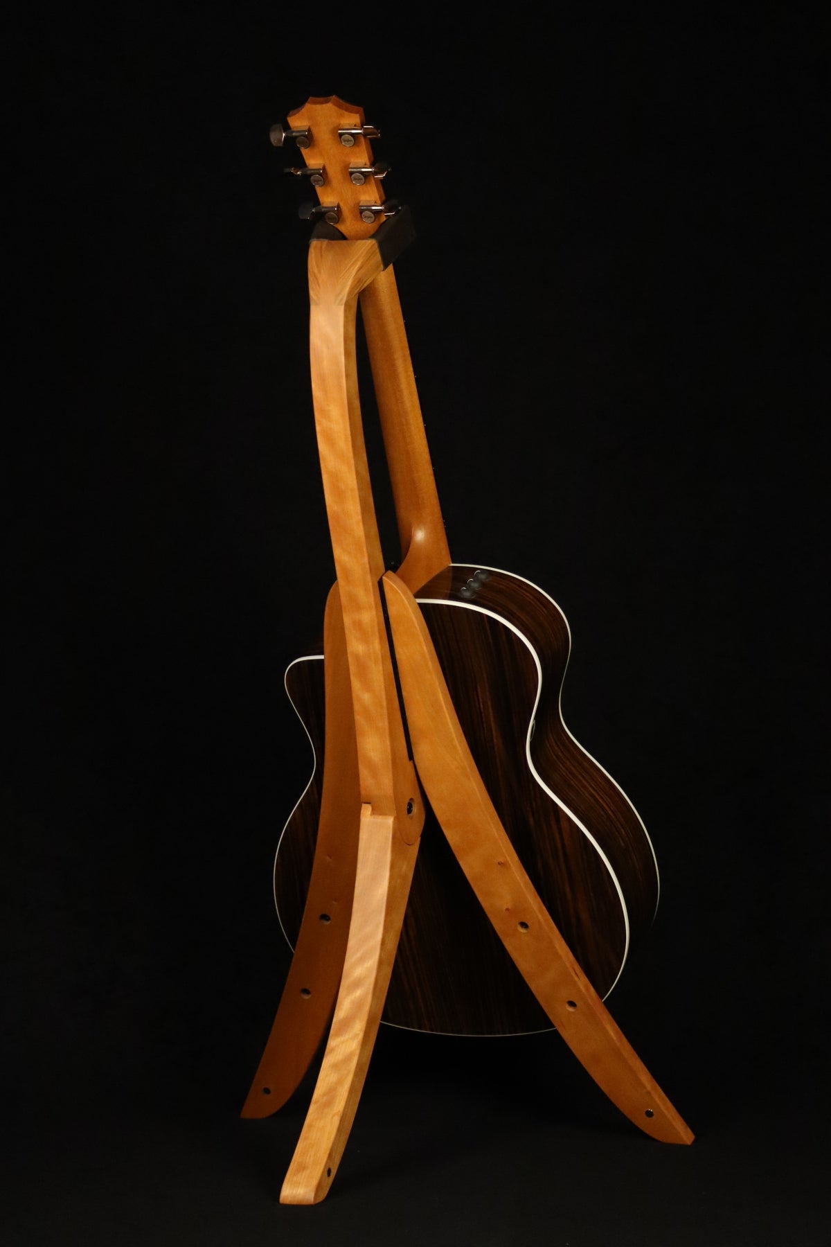 Folding cherry wood guitar floor stand full rear image with Taylor guitar
