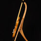 Folding cherry wood guitar floor stand full side image with Fender guitar