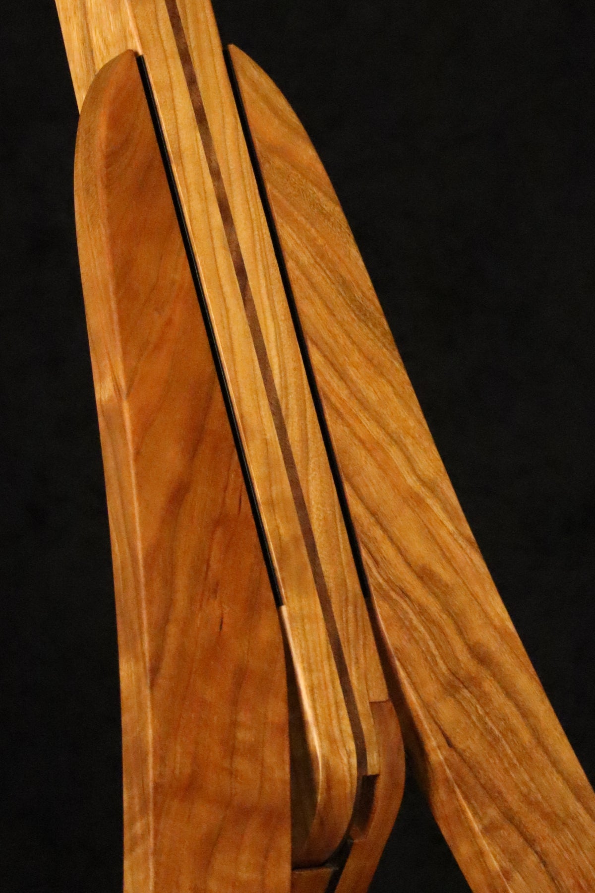 Folding cherry and walnut wood guitar floor stand closeup front image