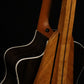 Folding cherry and walnut wood guitar floor stand closeup rear image with Taylor guitar