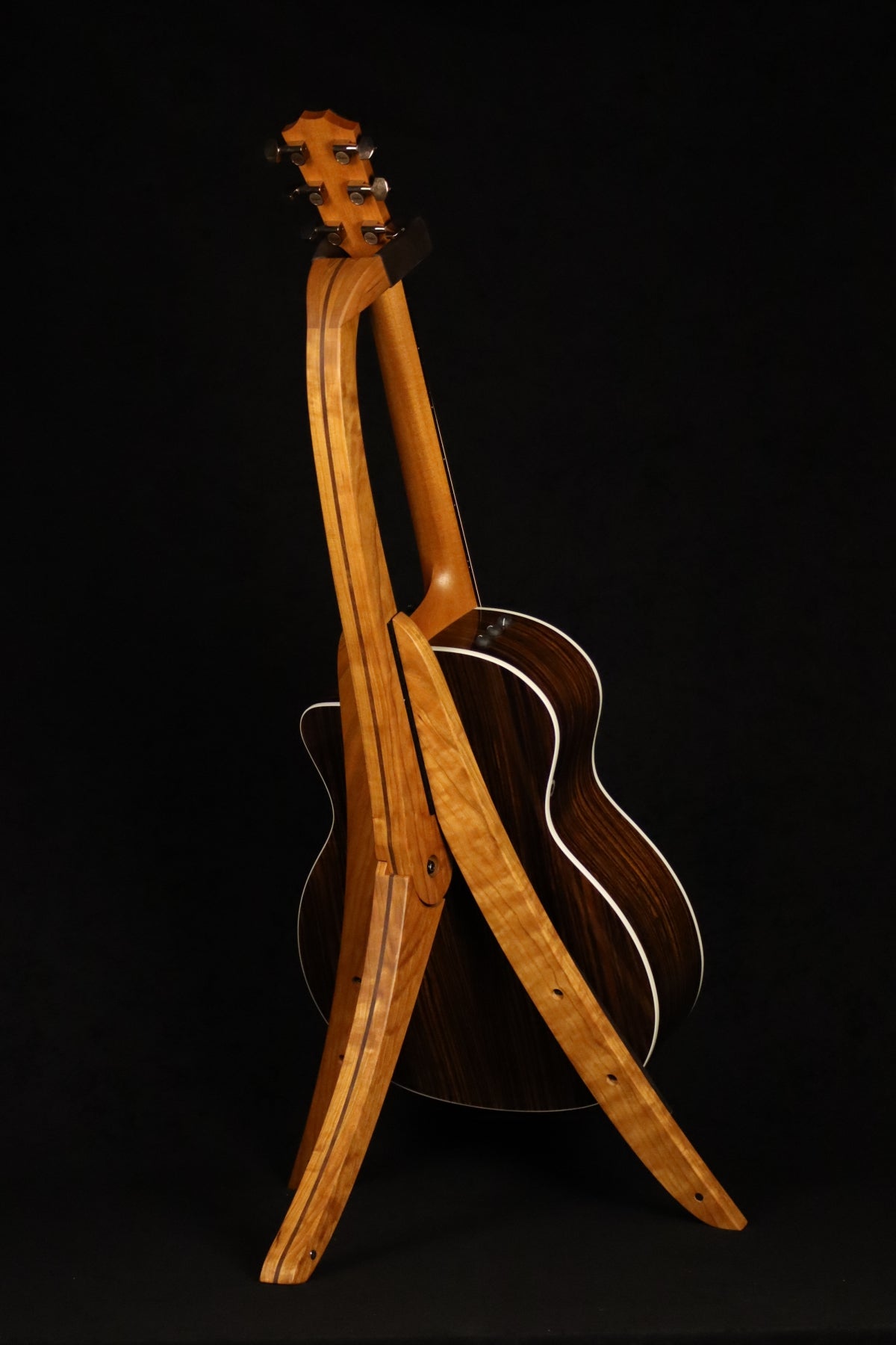 Folding cherry and walnut wood guitar floor stand full rear image with Taylor guitar
