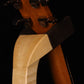 Folding curly maple wood guitar floor stand yoke detail image with Taylor guitar