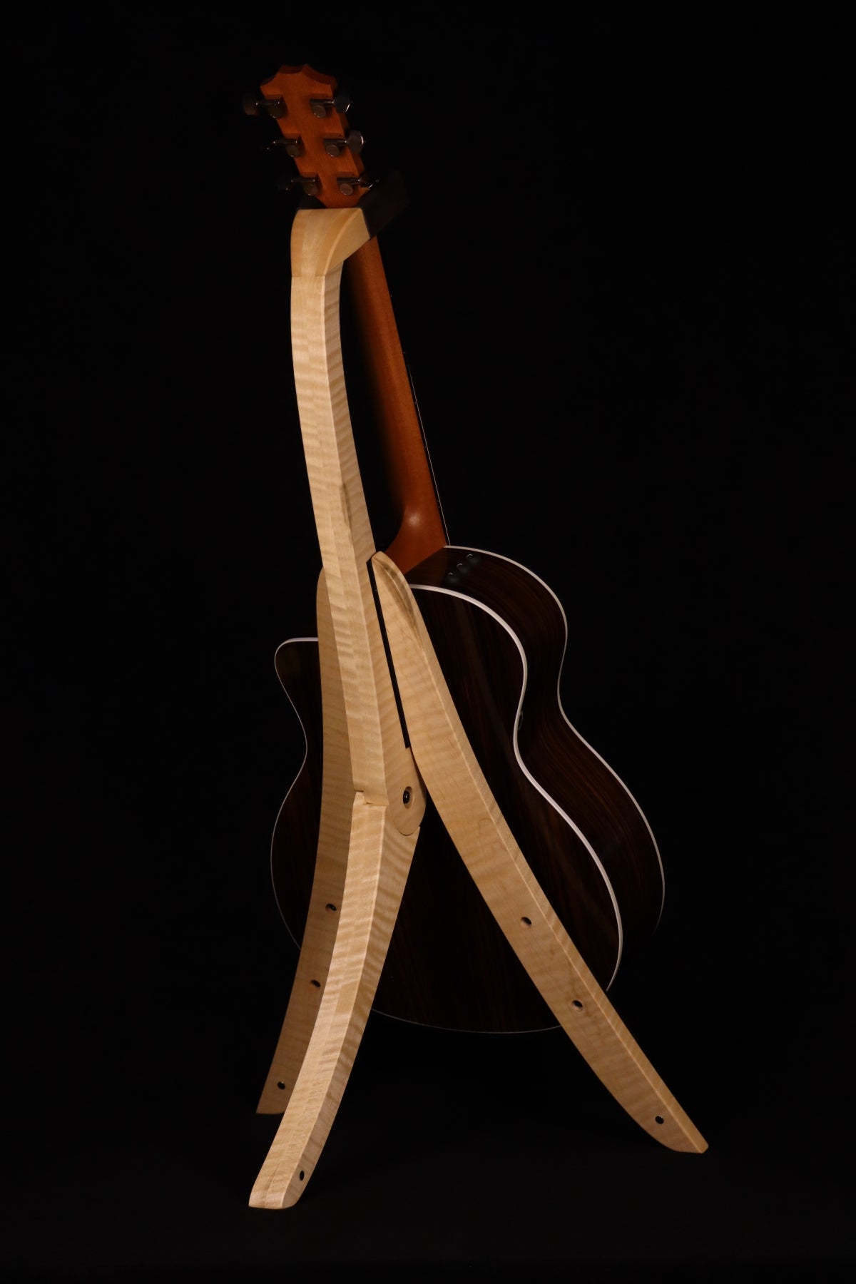 Folding curly maple wood guitar floor stand full rear image with Taylor guitars