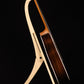 Folding curly maple wood guitar floor stand full side image with Taylor guitar