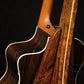 Folding chechen Caribbean rosewood and curly maple wood guitar floor stand closeup rear image with Taylor guitar