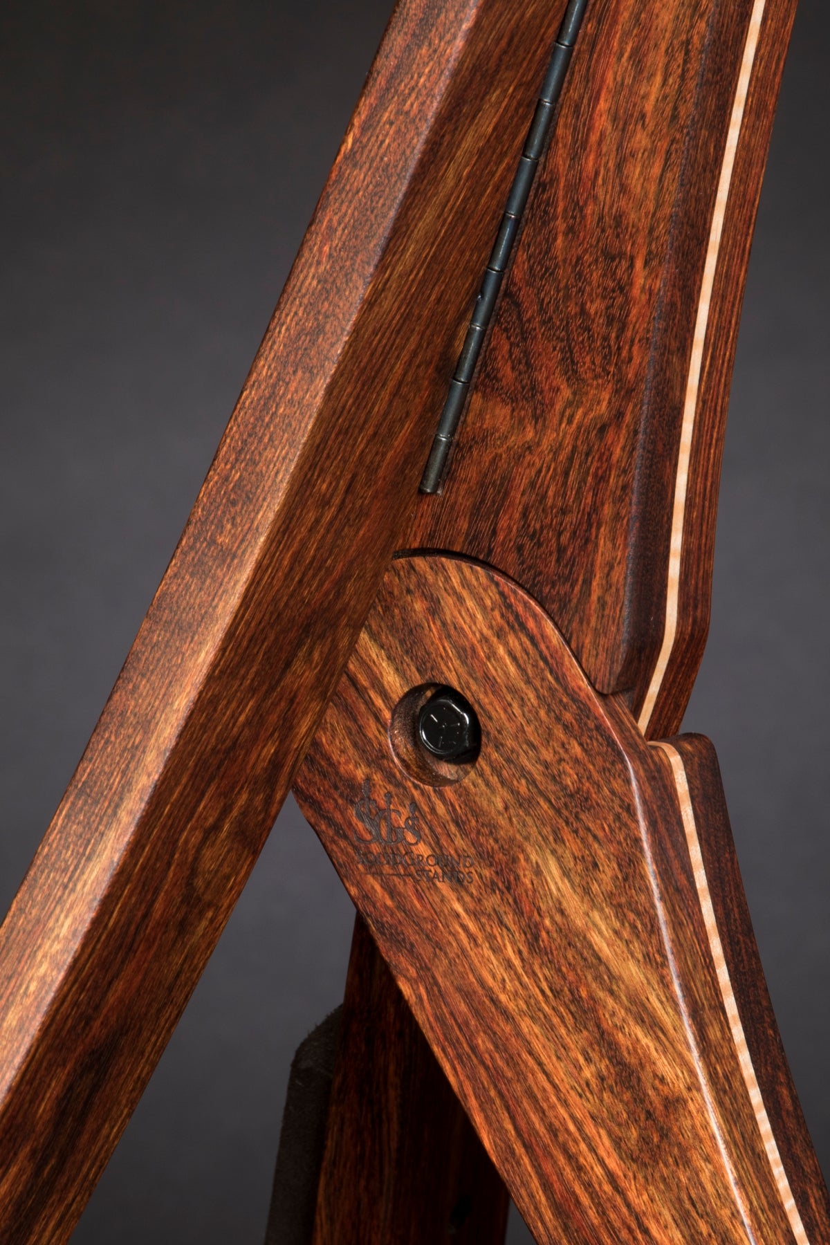 Folding chechen Caribbean rosewood and curly maple wood guitar floor stand joinery detail image