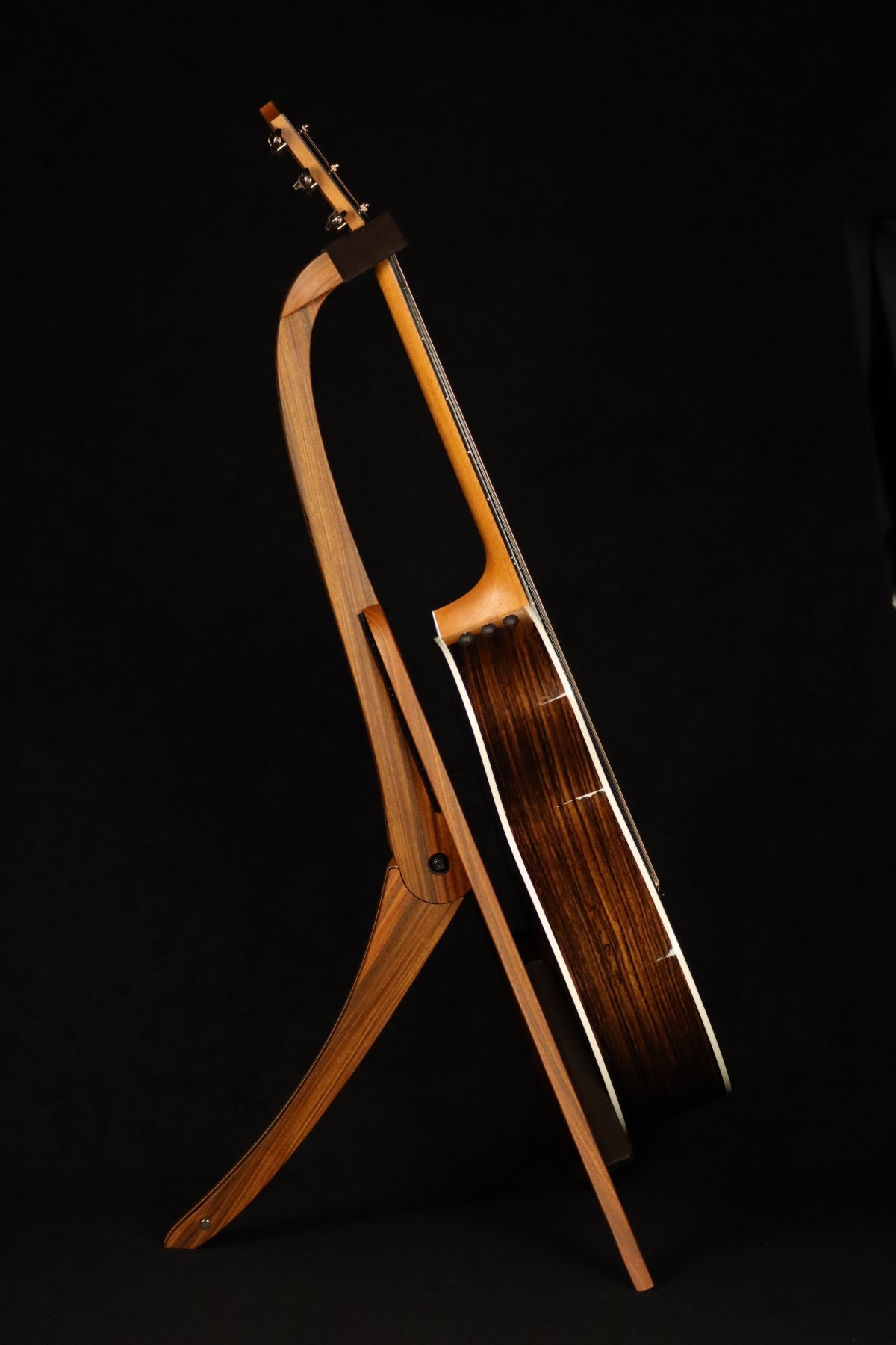 Folding morado Bolivian rosewood pau fero and curly maple wood guitar floor stand full side image with Taylor guitar
