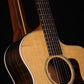 Folding morado Bolivian rosewood pau fero and curly maple wood guitar floor stand closeup front image with Taylor guitar