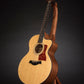 Folding sapele mahogany wood guitar floor stand full front image with Taylor guitar