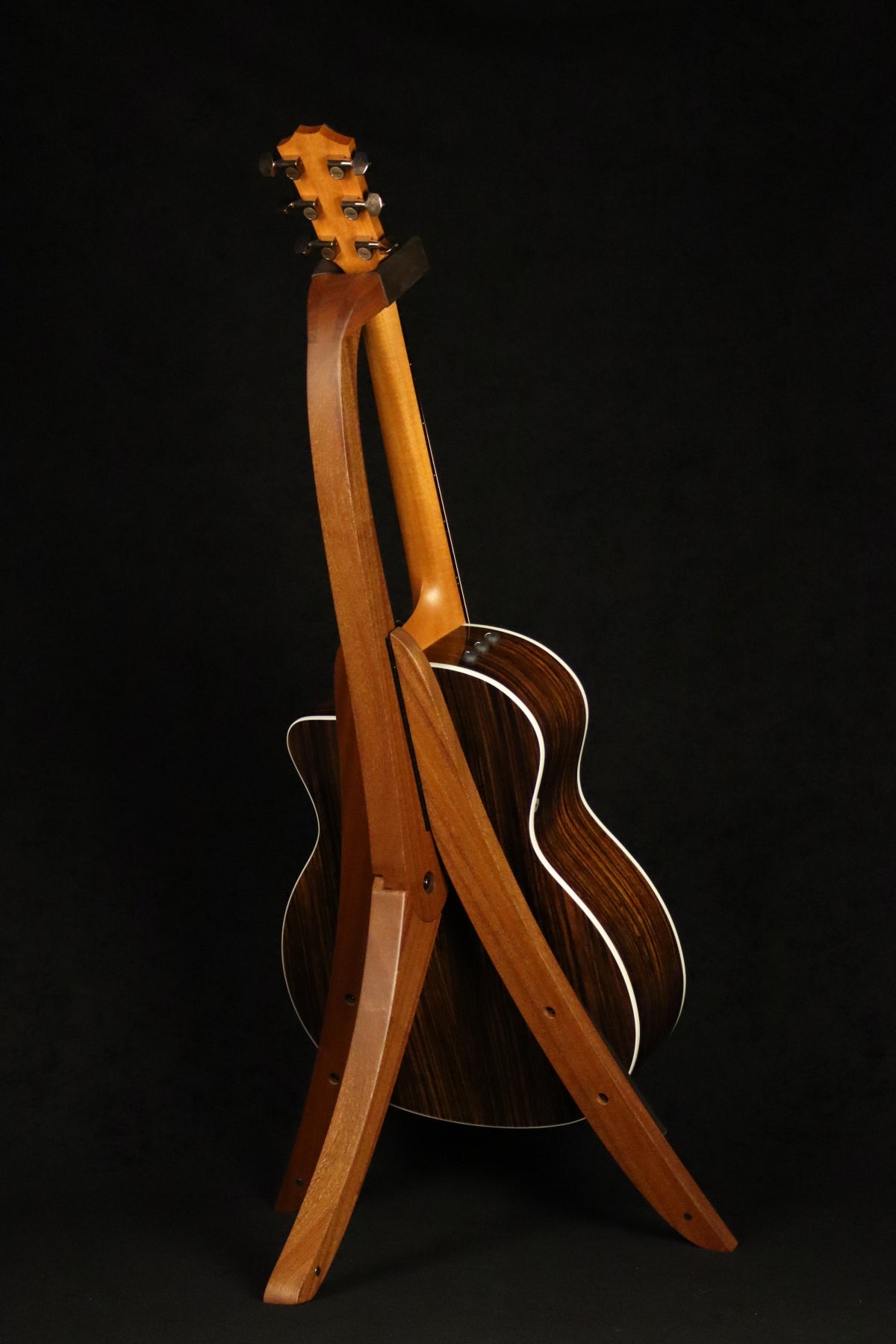 Folding sapele mahogany wood guitar floor stand full rear image with Taylor guitar