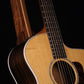 Folding sapele mahogany and curly maple wood guitar floor stand closeup front image with Taylor guitar