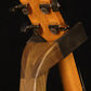 Folding walnut wood guitar floor stand yoke detail image with Taylor guitar