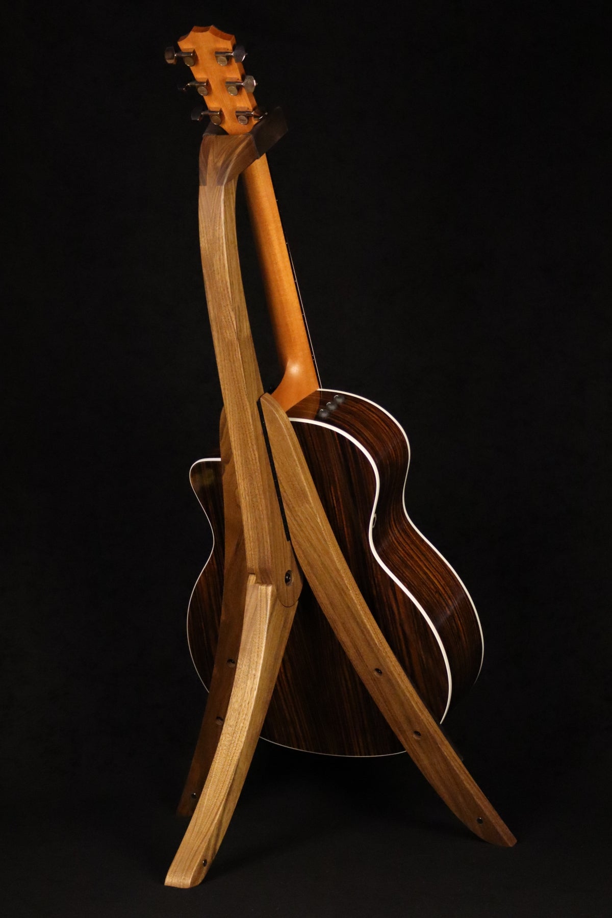 Folding walnut wood guitar floor stand full rear image with Taylor guitar