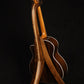 Folding walnut and curly maple wood guitar floor stand full rear image with Taylor guitar