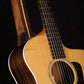 Folding walnut and curly maple wood guitar floor stand closeup front image with Taylor guitar