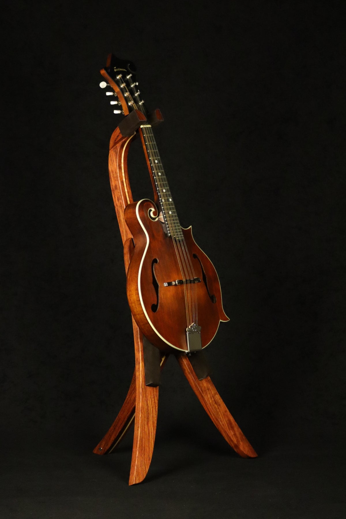 Folding bubinga rosewood and curly maple wood mandolin floor stand full front image with Eastman mandolin