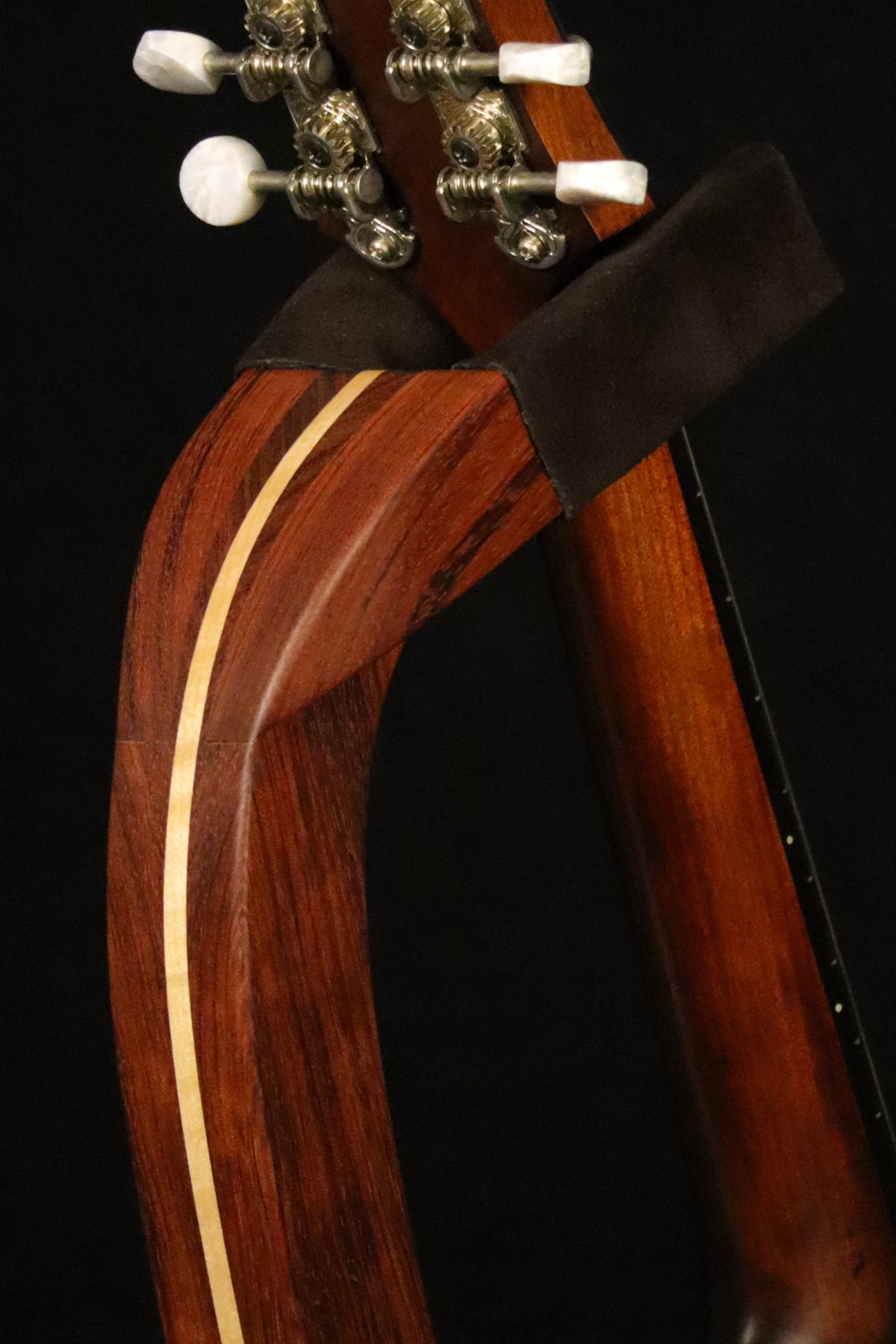 Folding bubinga rosewood and curly maple wood mandolin floor stand yoke detail image with Eastman mandolin