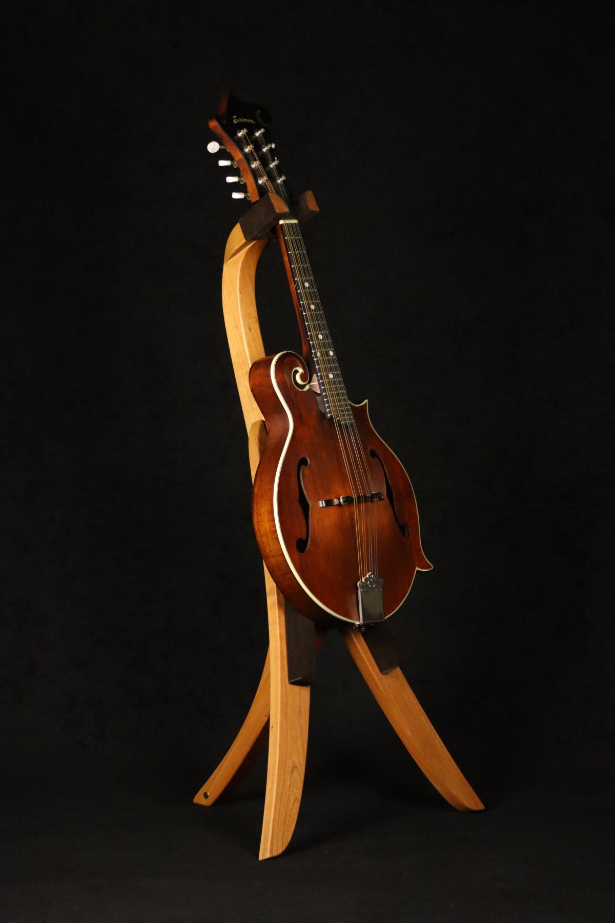 Folding cherry wood mandolin floor stand full front image with Eastman mandolin